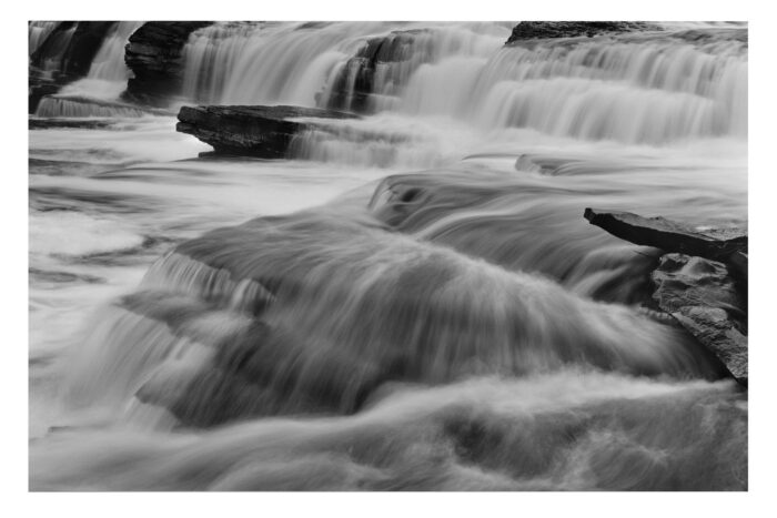 "Black River #7" is offered as a limited edition, fine art black and white photographic print. I captured this subject in 4x5 film with an Ebony 4x5 view camera and 135mm APO Rodenstock Sironar S APO lens in the Upper Peninsula of Michigan.
