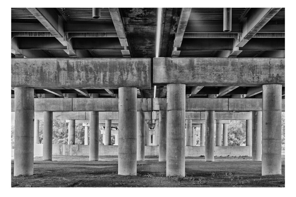 Limited Edition, fine art black and white photographic print, "Under Interstate 675 #4", of the Henry Marsh Bridge that spans the Saginaw River in Michigan.