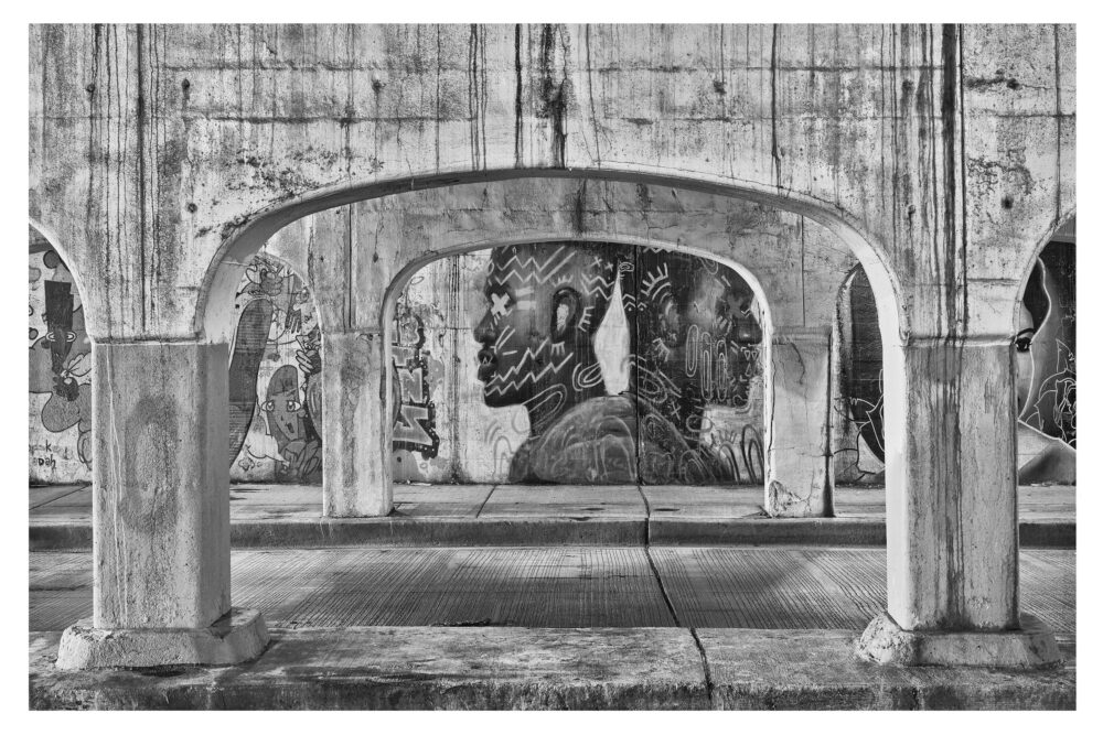 Limited Edition, fine art black and white photographic print, "Chicago Viaduct #32" was shot in Chicago, Illinois under the rails in Pilsen on Peoria Street.
