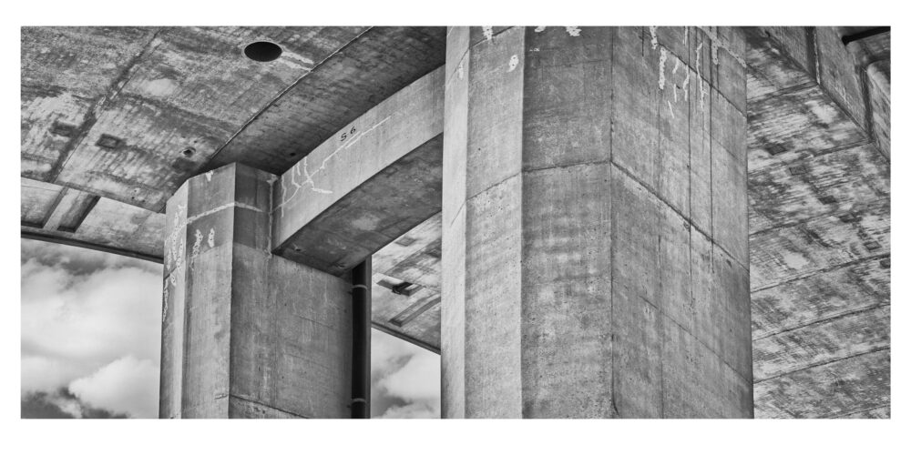 This Limited Edition, fine art black and white photographic print, "Interstate 75, Span 6 #3, a Panorama" was shot under the bridge spanning the Saginaw River in Michigan.